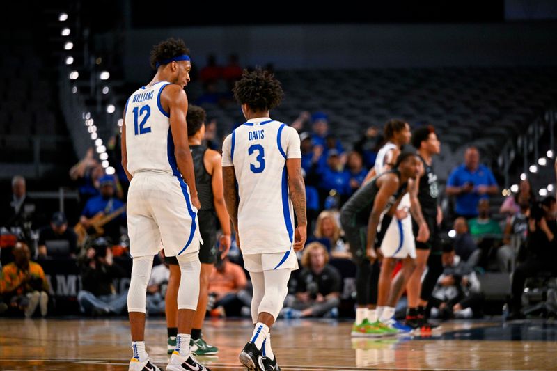 Mar 11, 2023; Fort Worth, TX, USA; Memphis Tigers forward DeAndre Williams (12) and guard Kendric Davis (3) leave the game against the Tulane Green Wave during the second half at Dickies Arena. Mandatory Credit: Jerome Miron-USA TODAY Sports