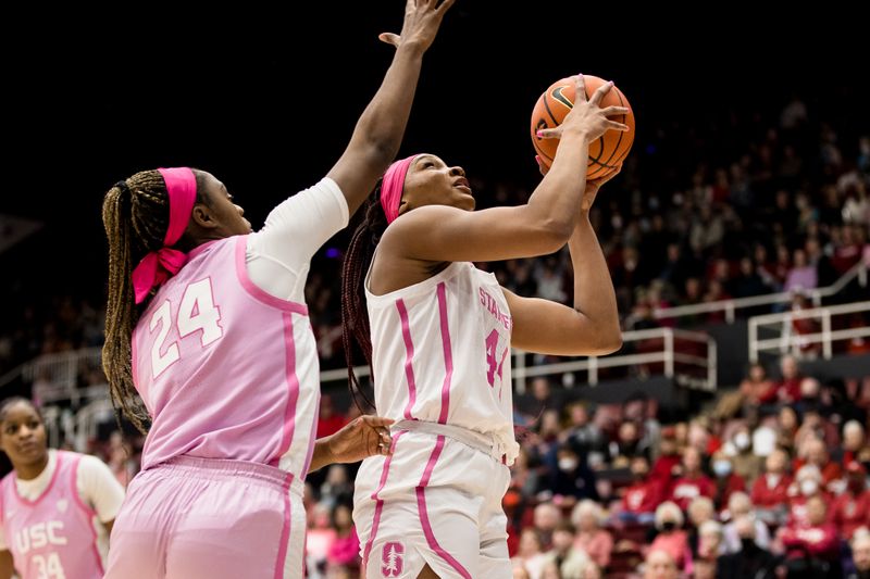 Feb 17, 2023; Stanford, California, USA;  USC Trojans guard Okako Adika (24) defends Stanford Cardinal forward Kiki Iriafen (44) during the first half at Maples Pavilion. Mandatory Credit: John Hefti-USA TODAY Sports