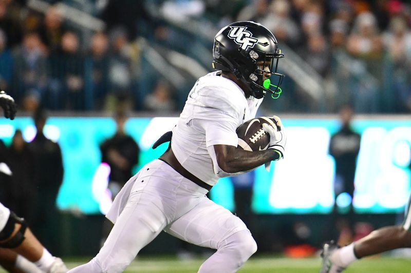 Nov 12, 2022; New Orleans, Louisiana, USA; UCF Knights running back Johnny Richardson (0) runs the ball against the Tulane Green Wave during the third quarter at Yulman Stadium. Mandatory Credit: Rebecca Warren-USA TODAY Sports