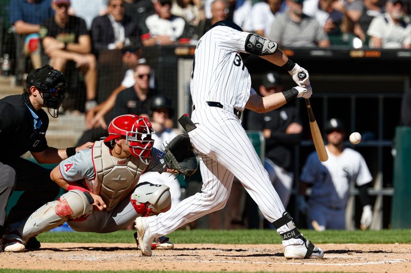 Sep 26, 2024; Chicago, Illinois, USA; Chicago White Sox outfielder Zach DeLoach (31) hits a one-run double against the Los Angeles Angels during the fifth inning at Guaranteed Rate Field. Mandatory Credit: Kamil Krzaczynski-Imagn Images