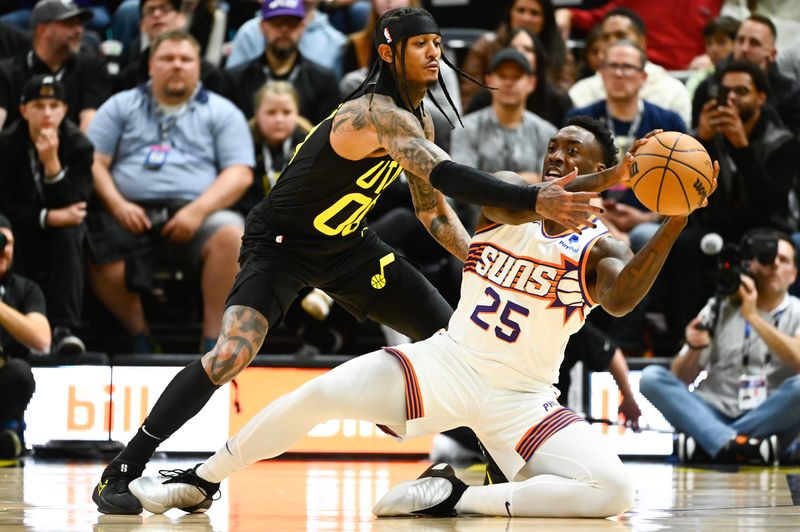 SALT LAKE CITY, UTAH - NOVEMBER 19: Jordan Clarkson #00 of the Utah Jazz defends Nassir Little #25 of the Phoenix Suns during the first half of a game at Delta Center on November 19, 2023 in Salt Lake City, Utah. NOTE TO USER: User expressly acknowledges and agrees that, by downloading and or using this photograph, User is consenting to the terms and conditions of the Getty Images License Agreement. (Photo by Alex Goodlett/Getty Images)