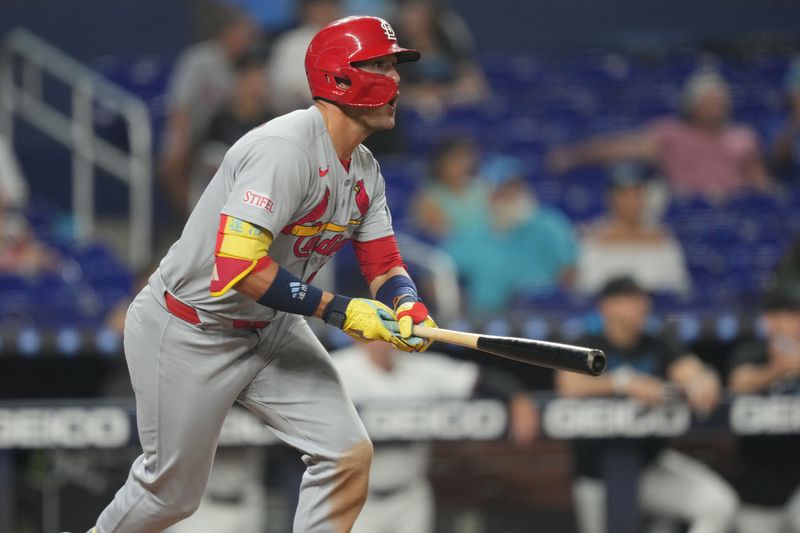 Aug 20, 2025; Miami, Florida, USA;  St. Louis Cardinals center fielder Lars Nootbaar (21) drives in a run on a ground rule double in the fifth inning against the Miami Marlins at loanDepot Park. Mandatory Credit: Jim Rassol-Imagn Images