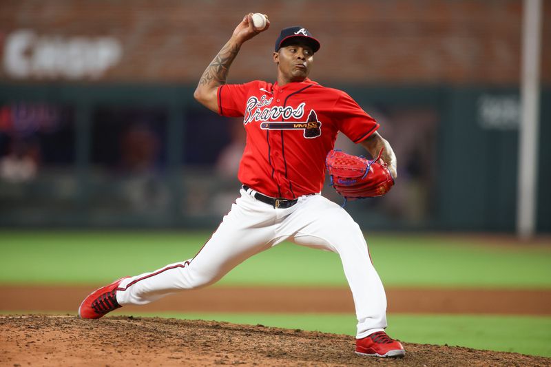 Sep 28, 2023; Atlanta, Georgia, USA; Atlanta Braves relief pitcher Raisel Iglesias (26) throws against the Chicago Cubs in the ninth inning at Truist Park. Mandatory Credit: Brett Davis-USA TODAY Sports
