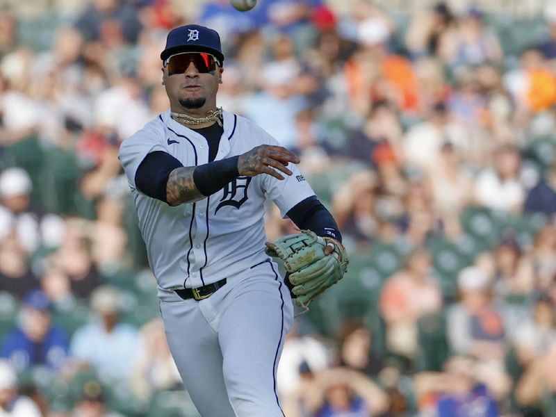 May 23, 2024; Detroit, Michigan, USA;  Detroit Tigers shortstop Javier Baez (28) makes a throw in the first inning against the Toronto Blue Jays at Comerica Park. Mandatory Credit: Rick Osentoski-USA TODAY Sports