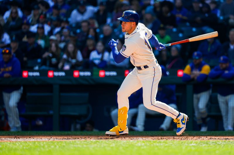 Oct 1, 2023; Seattle, Washington, USA; Seattle Mariners right fielder Jarred Kelenic (10) hits a single against the Texas Rangers during the fourth inning at T-Mobile Park. Mandatory Credit: Joe Nicholson-USA TODAY Sports