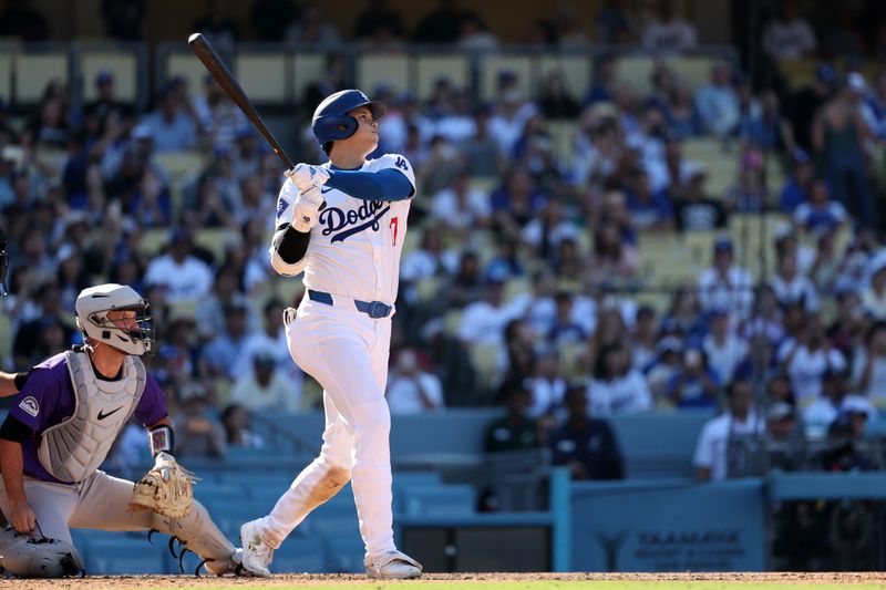 Sep 22, 2024; Los Angeles, California, USA;  Los Angeles Dodgers designated hitter Shohei Ohtani (17) hits a home run during the ninth inning against the Colorado Rockies at Dodger Stadium. Mandatory Credit: Kiyoshi Mio-Imagn Images