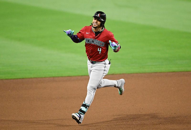 Jun 6, 2024; San Diego, California, USA; Arizona Diamondbacks second baseman Ketel Marte (4) rounds the bases after hitting a two-run home run during the seventh inning against the San Diego Padres at Petco Park. Mandatory Credit: Denis Poroy-USA TODAY Sports at Petco Park. 