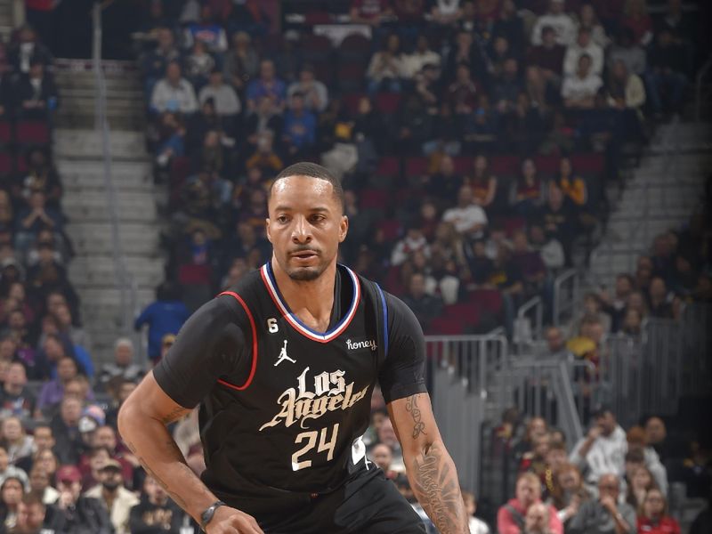 CLEVELAND, OH - JANUARY 29: Norman Powell #24 of the LA Clippers dribbles the ball during the game against the Cleveland Cavaliers on January 29, 2023 at Rocket Mortgage FieldHouse in Cleveland, Ohio. NOTE TO USER: User expressly acknowledges and agrees that, by downloading and/or using this Photograph, user is consenting to the terms and conditions of the Getty Images License Agreement. Mandatory Copyright Notice: Copyright 2023 NBAE (Photo by David Liam Kyle/NBAE via Getty Images)