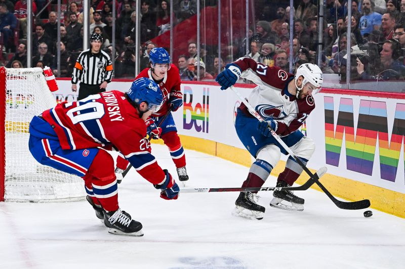 Jan 15, 2024; Montreal, Quebec, CAN; Colorado Avalanche left wing Jonathan Drouin (27) plays the puck against Montreal Canadiens left wing Juraj Slafkovsky (20) during the first period at Bell Centre. Mandatory Credit: David Kirouac-USA TODAY Sports