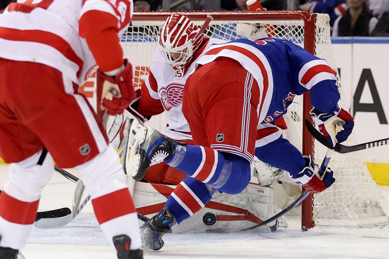 Nov 29, 2023; New York, New York, USA; Detroit Red Wings goaltender Ville Husso (35) makes a save against New York Rangers left wing Jimmy Vesey (26) during the first period at Madison Square Garden. Mandatory Credit: Brad Penner-USA TODAY Sports