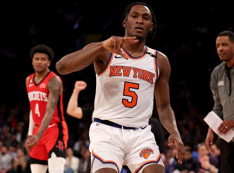 NEW YORK, NEW YORK - MARCH 27: Immanuel Quickley #5 of the New York Knicks celebrates his three point shot in the fourth quarter against the New York Knicks at Madison Square Garden on March 27, 2023 in New York City. The New York Knicks defeated the Houston Rockets 137-115. NOTE TO USER: User expressly acknowledges and agrees that, by downloading and or using this photograph, User is consenting to the terms and conditions of the Getty Images License Agreement. (Photo by Elsa/Getty Images)