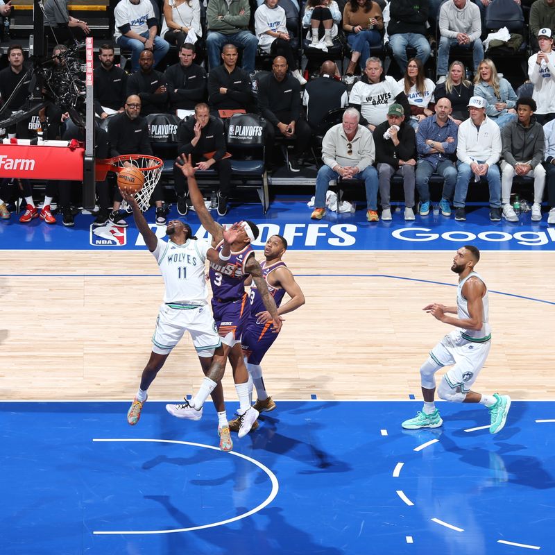 MINNEAPOLIS, MN -  APRIL 20: Naz Reid #11 of the Minnesota Timberwolves drives to the basket during the game against the Phoenix Suns during Round 1 Game 1 of the 2024 NBA Playoffs on April 20, 2024 at Target Center in Minneapolis, Minnesota. NOTE TO USER: User expressly acknowledges and agrees that, by downloading and or using this Photograph, user is consenting to the terms and conditions of the Getty Images License Agreement. Mandatory Copyright Notice: Copyright 2024 NBAE (Photo by David Sherman/NBAE via Getty Images)