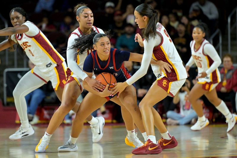 Dec 2, 2025; Los Angeles, California, USA;  USC Trojans guard Kennedy Smith (11) and guard Jazzy Davidson (9) defend Saint Mary's Gaels guard Malia Latu (13) during the first half at Galen Center. Mandatory Credit: Jayne Kamin-Oncea-Imagn Images