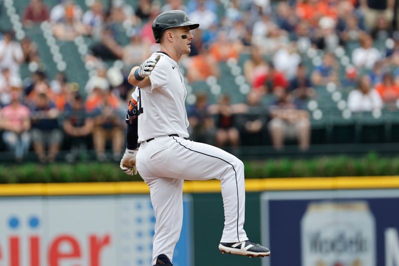 Apr 28, 2024; Detroit, Michigan, USA;  Detroit Tigers outfielder Mark Canha (21) celebrates after he hits a double in the first inning against the Kansas City Royals at Comerica Park. Mandatory Credit: Rick Osentoski-USA TODAY Sports