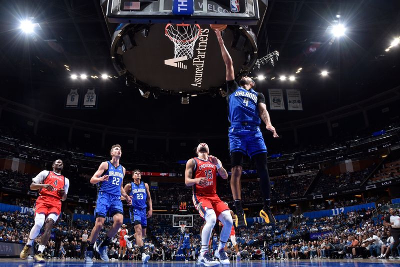 ORLANDO, FL - NOVEMBER 8: Jalen Suggs #4 of the Orlando Magic drives to the basket during the game against the New Orleans Pelicans on November 8, 2024 at the Kia Center in Orlando, Florida. NOTE TO USER: User expressly acknowledges and agrees that, by downloading and or using this photograph, User is consenting to the terms and conditions of the Getty Images License Agreement. Mandatory Copyright Notice: Copyright 2024 NBAE (Photo by Fernando Medina/NBAE via Getty Images)