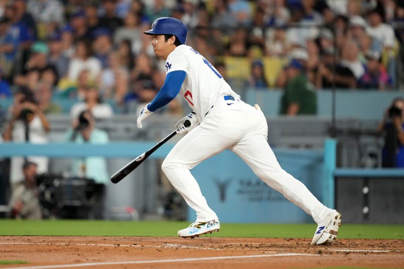 Aug 20, 2024; Los Angeles, California, USA; Los Angeles Dodgers designated hitter Shohei Ohtani (17) hits a triple in the third inning against the Seattle Mariners at Dodger Stadium. Mandatory Credit: Kirby Lee-USA TODAY Sports