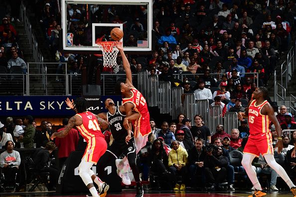 ATLANTA, GA - DECEMBER 6: De'Andre Hunter #12 of the Atlanta Hawks goes up for the rebound during the game against the Brooklyn Nets on December 6, 2023 at State Farm Arena in Atlanta, Georgia.  NOTE TO USER: User expressly acknowledges and agrees that, by downloading and/or using this Photograph, user is consenting to the terms and conditions of the Getty Images License Agreement. Mandatory Copyright Notice: Copyright 2023 NBAE (Photo by Scott Cunningham/NBAE via Getty Images)