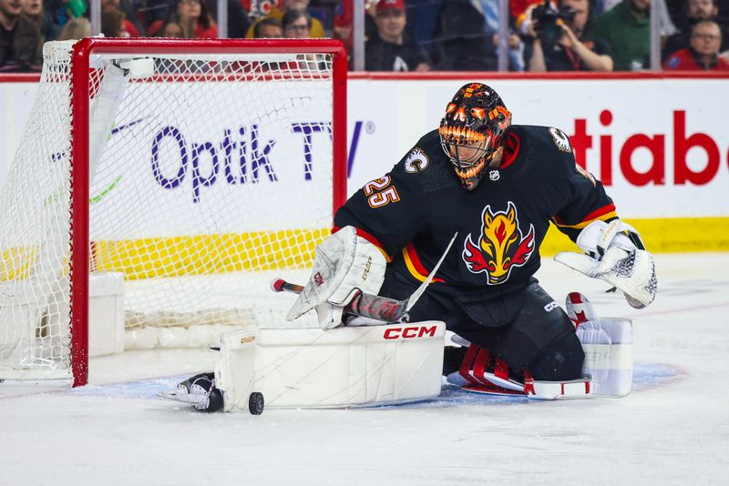 Jan 27, 2024; Calgary, Alberta, CAN; Calgary Flames goaltender Jacob Markstrom (25) makes a save against the Chicago Blackhawks during the third period at Scotiabank Saddledome. Mandatory Credit: Sergei Belski-USA TODAY Sports