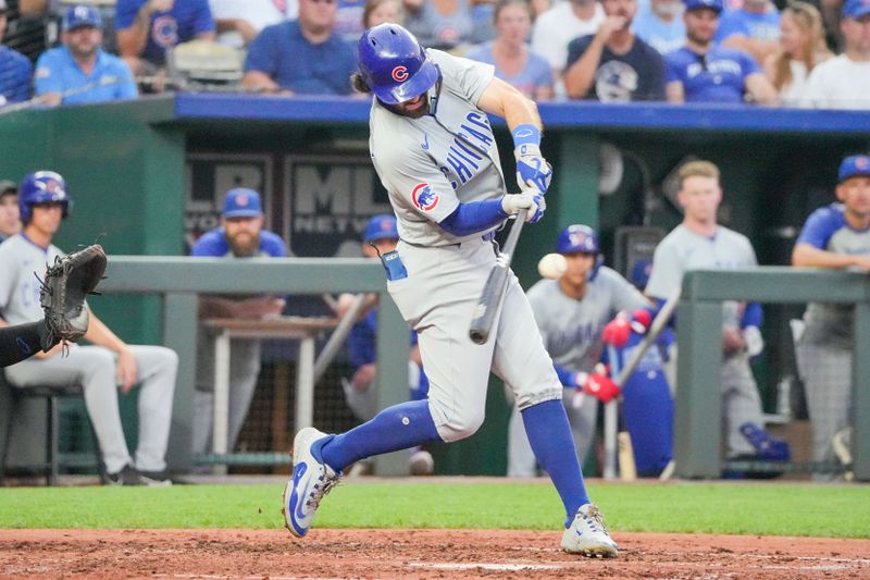 Jul 26, 2024; Kansas City, Missouri, USA; Chicago Cubs shortstop Dansby Swanson (7) hits a double against the Kansas City Royals in the fifth inning at Kauffman Stadium. Mandatory Credit: Denny Medley-USA TODAY Sports