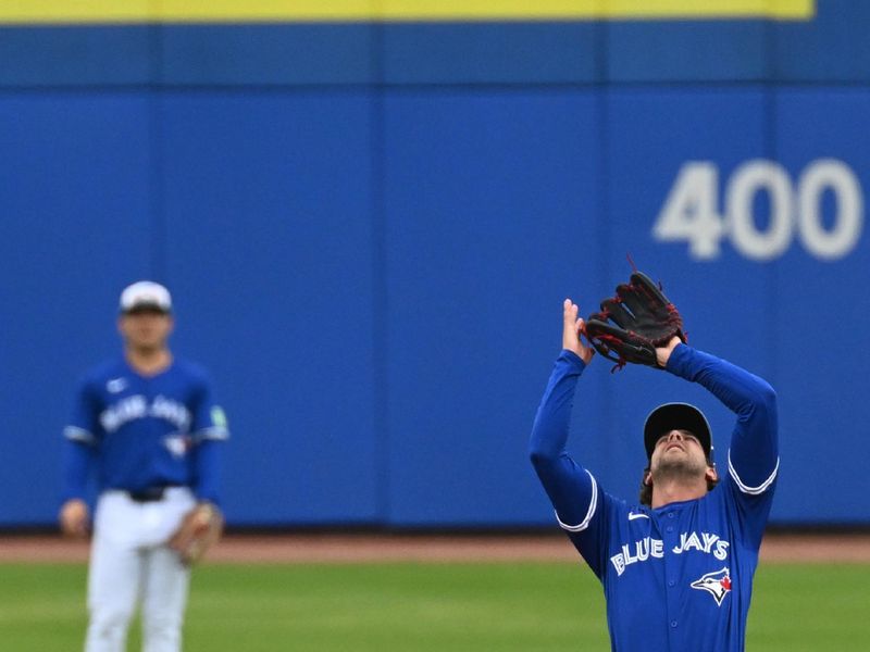 Mar 22, 2024; Dunedin, Florida, USA; Toronto Blue Jays second baseman Ernie Clement (28) catches a fly ball in the third inning of the spring training game against the Boston Red Sox at TD Ballpark. Mandatory Credit: Jonathan Dyer-USA TODAY Sports