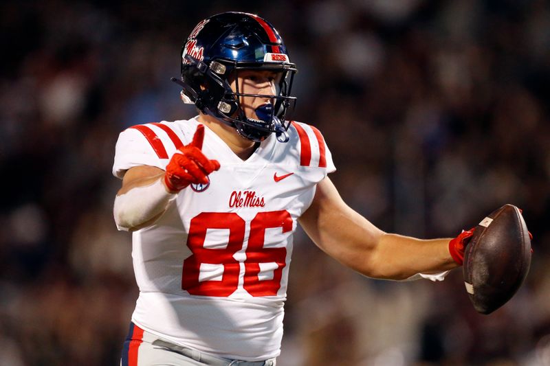 Nov 23, 2023; Starkville, Mississippi, USA; Mississippi Rebels tight end Caden Prieskorn (86) reacts after catching  the ball for a touchdown during the second half against the Mississippi State Bulldogs at Davis Wade Stadium at Scott Field. Mandatory Credit: Petre Thomas-USA TODAY Sports