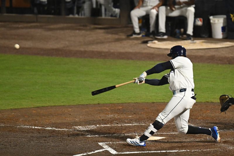 May 8, 2025; St. Petersburg, Florida, USA;Tampa Bay Rays designated hitter Yandy Diaz (2) hits a three run home run in the seventh inning against the Philadelphia Phillies at George M. Steinbrenner Field. Mandatory Credit: Jonathan Dyer-Imagn Images