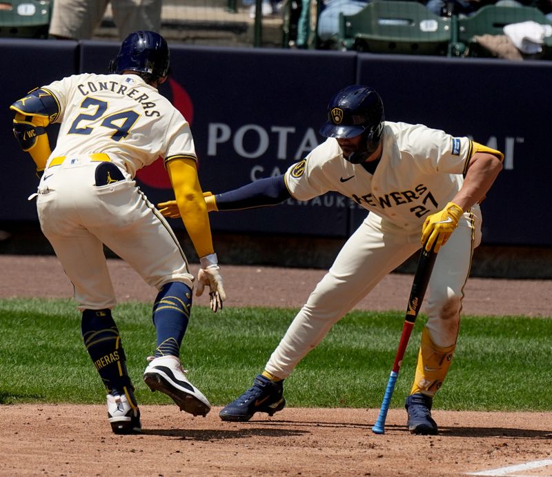 May 15, 2024; Milwaukee, Wisconsin, USA; Milwaukee Brewers catcher William Contreras (24) celebrates his three-run home run with shortstop Willy Adames (27) during the third inning of their game against the Pittsburgh Pirates at American Family Field. Mandatory Credit: Mark Hoffman-USA TODAY Sports