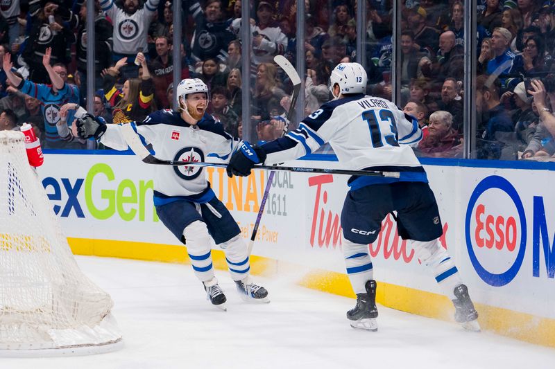 Feb 17, 2024; Vancouver, British Columbia, CAN; Winnipeg Jets forward Kyle Connor (81) and forward Gabriel Vilardi (13) celebrate Vilardi   s goal against the Vancouver Canucks in the third period at Rogers Arena. Jets won 4-2. Mandatory Credit: Bob Frid-USA TODAY Sports