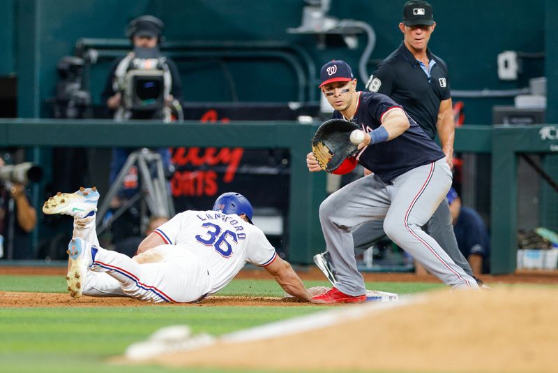 May 1, 2024; Arlington, Texas, USA; Texas Rangers outfielder Wyatt Langford (36) slides in under a tag attempt by Washington Nationals first base Joey Meneses (45) during the eighth inning at Globe Life Field. Mandatory Credit: Andrew Dieb-USA TODAY Sports