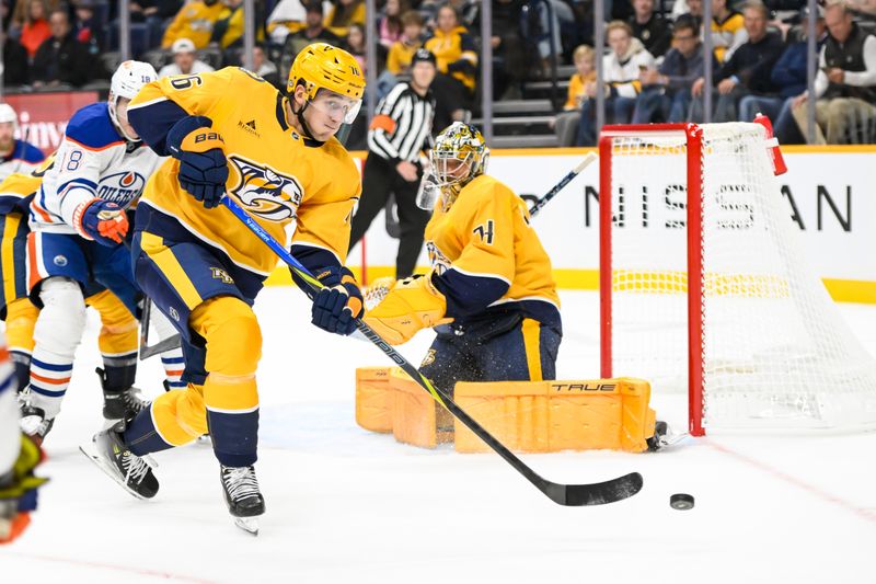 Oct 17, 2024; Nashville, Tennessee, USA;  Nashville Predators defenseman Brady Skjei (76) clears the puck against the Edmonton Oilers during the second period at Bridgestone Arena. Mandatory Credit: Steve Roberts-Imagn Images