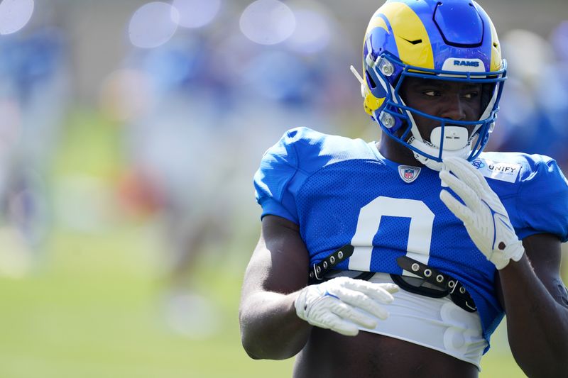 Los Angeles Rams linebacker Byron Young warms up before facing the Denver Broncos during an NFL football training camp practice Wednesday, Aug. 23, 2023, at the Broncos' headquarters in Centennial, Colo. (AP Photo/David Zalubowski)