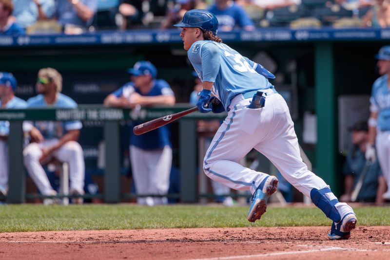 Jun 4, 2023; Kansas City, Missouri, USA; Kansas City Royals first baseman Nick Pratto (32) watches the ball after a hit during the sixth inning against the Colorado Rockies at Kauffman Stadium. Mandatory Credit: William Purnell-USA TODAY Sports