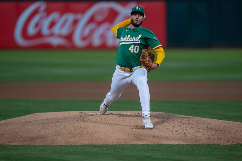 Sep 24, 2024; Oakland, California, USA; Oakland Athletics starting pitcher Mitch Spence (40) delivers a pitch against the Texas Rangers during the first inning at Oakland-Alameda County Coliseum. Mandatory Credit: Neville E. Guard-Imagn Images