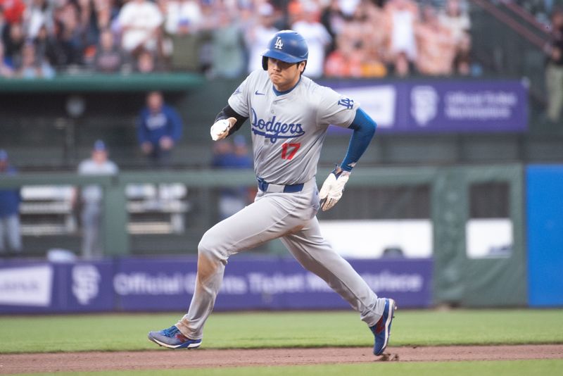 Jun 29, 2024; San Francisco, California, USA; Los Angeles Dodgers two-way player Shohei Ohtani (17) rounds second base during the tenth inning against the San Francisco Giants at Oracle Park. Mandatory Credit: Ed Szczepanski-USA TODAY Sports