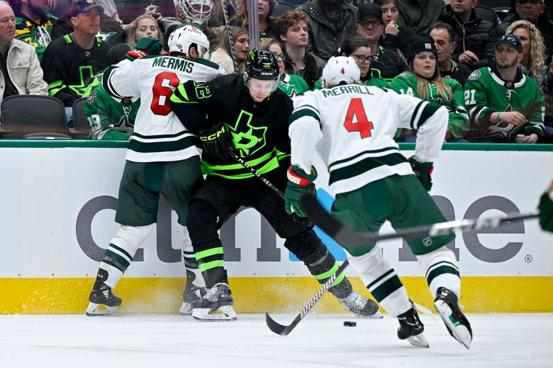 Jan 10, 2024; Dallas, Texas, USA; Minnesota Wild defenseman Dakota Mermis (6) and defenseman Jon Merrill (4) and Dallas Stars center Radek Faksa (12) battle for control of the puck during the second period at the American Airlines Center. Mandatory Credit: Jerome Miron-USA TODAY Sports