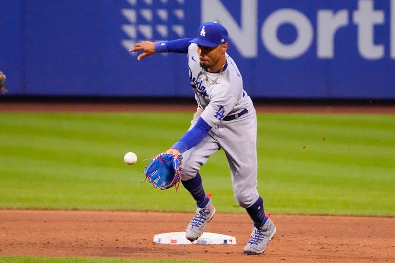 Jul 16, 2023; New York City, New York, USA; Los Angeles Dodgers second baseman Mookie Betts (50) fields a ground ball hit by New York Mets shortstop Francisco Lindor (not pictured) during the eighth inning at Citi Field. Mandatory Credit: Gregory Fisher-USA TODAY Sports