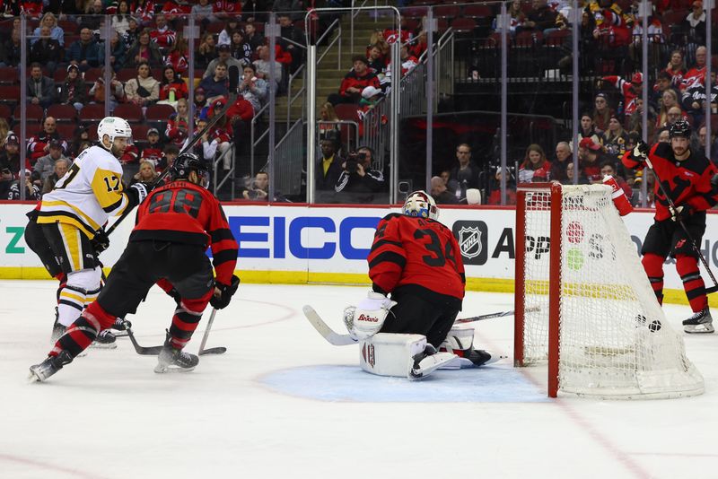 Mar 19, 2024; Newark, New Jersey, USA; Pittsburgh Penguins right wing Bryan Rust (17) scores a goal against the New Jersey Devils during the third period at Prudential Center. Mandatory Credit: Ed Mulholland-USA TODAY Sports