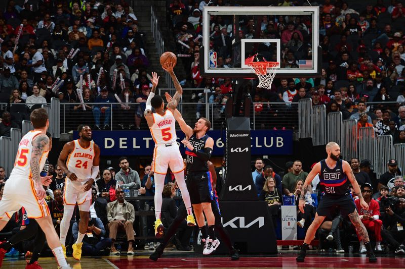 ATLANTA, GA - APRIL 3: Dejounte Murray #5 of the Atlanta Hawks shoots the ball during the game against the Detroit Pistons on April 3, 2024 at State Farm Arena in Atlanta, Georgia.  NOTE TO USER: User expressly acknowledges and agrees that, by downloading and/or using this Photograph, user is consenting to the terms and conditions of the Getty Images License Agreement. Mandatory Copyright Notice: Copyright 2024 NBAE (Photo by Scott Cunningham/NBAE via Getty Images)