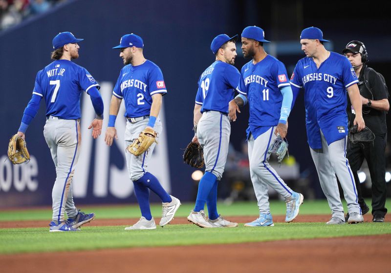 May 1, 2024; Toronto, Ontario, CAN; Kansas City Royals second baseman Michael Massey (19) celebrates with teammates after winning against the Toronto Blue Jays at the end of the ninth inning at Rogers Centre. Mandatory Credit: Nick Turchiaro-USA TODAY Sports
