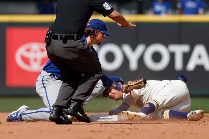 Aug 27, 2023; Seattle, Washington, USA; Seattle Mariners second baseman Josh Rojas (4) steals second base before Kansas City Royals shortstop Bobby Witt Jr. (7) can apply a tag during the fifth inning at T-Mobile Park. Mandatory Credit: Joe Nicholson-USA TODAY Sports