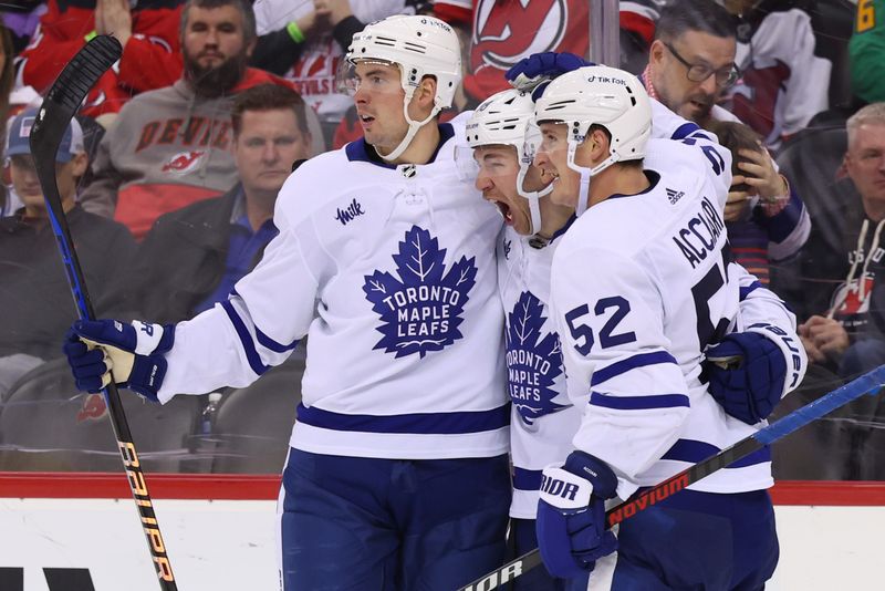 Mar 7, 2023; Newark, New Jersey, USA; Toronto Maple Leafs left wing Michael Bunting (58) celebrates his goal against the New Jersey Devils during the third period at Prudential Center. Mandatory Credit: Ed Mulholland-USA TODAY Sports