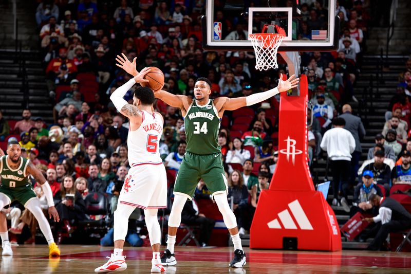 HOUSTON, TX - JANUARY 6: Fred VanVleet #5 of the Houston Rockets looks to pass the ball while Giannis Antetokounmpo #34 of the Milwaukee Bucks plays defense during the game on January 6, 2024 at the Toyota Center in Houston, Texas. NOTE TO USER: User expressly acknowledges and agrees that, by downloading and or using this photograph, User is consenting to the terms and conditions of the Getty Images License Agreement. Mandatory Copyright Notice: Copyright 2024 NBAE (Photo by Logan Riely/NBAE via Getty Images)