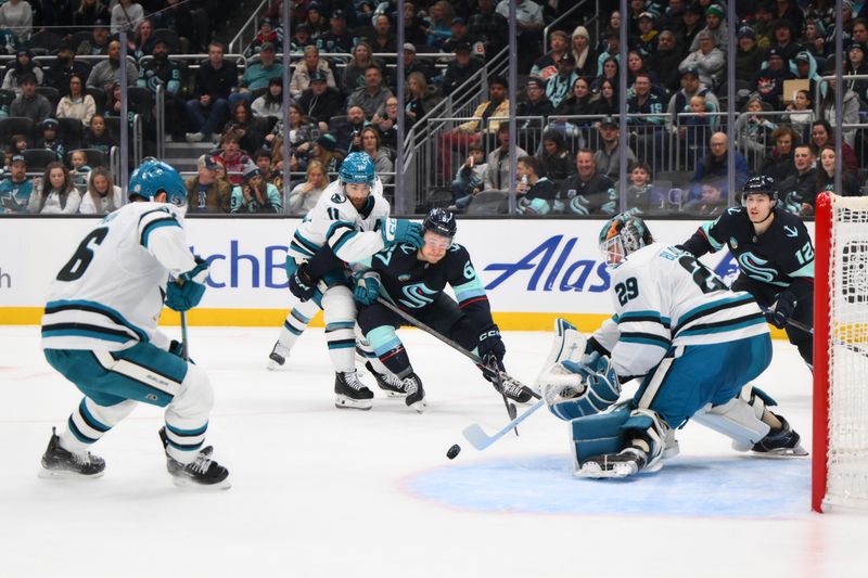 Nov 30, 2024; Seattle, Washington, USA; San Jose Sharks goaltender Mackenzie Blackwood (29) blocks a goal shot by Seattle Kraken center Mitchell Stephens (67) during the second period at Climate Pledge Arena. Mandatory Credit: Steven Bisig-Imagn Images