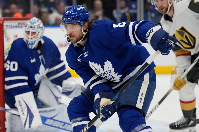 Nov 20, 2024; Toronto, Ontario, CAN; Toronto Maple Leafs defenseman Chris Tanev (8) follows the play against the Vegas Golden Knights during the second period at Scotiabank Arena. Mandatory Credit: John E. Sokolowski-Imagn Images