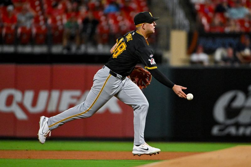 Sep 16, 2024; St. Louis, Missouri, USA;  Pittsburgh Pirates second baseman Nick Yorke (38) tosses the ball to first base against the St. Louis Cardinals during the fourth inning of his Major League debut during the fourth inning at Busch Stadium. Mandatory Credit: Jeff Curry-Imagn Images