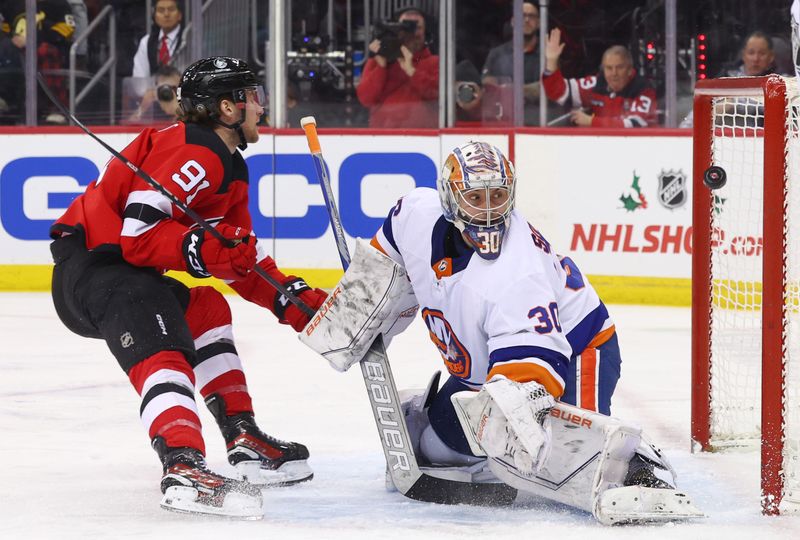 Nov 28, 2023; Newark, New Jersey, USA; New Jersey Devils center Dawson Mercer (91) scores a goal on New York Islanders goaltender Ilya Sorokin (30) during the second period at Prudential Center. Mandatory Credit: Ed Mulholland-USA TODAY Sports