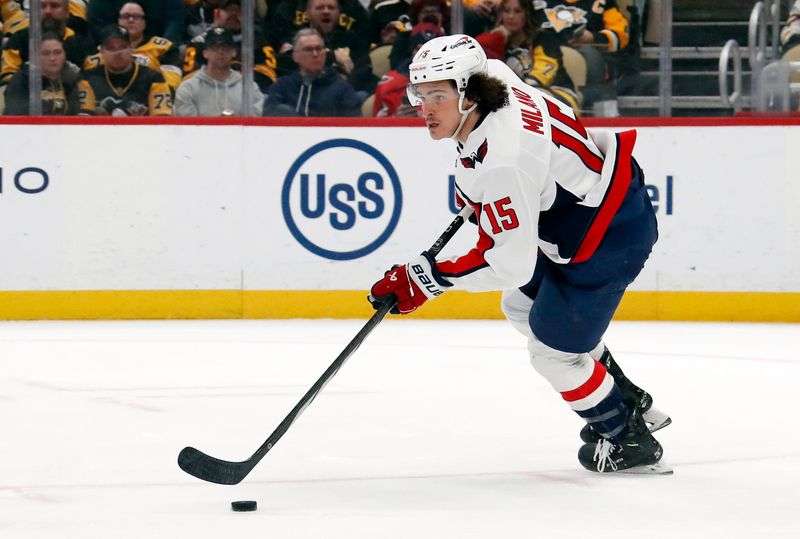 Mar 7, 2024; Pittsburgh, Pennsylvania, USA; Washington Capitals left wing Sonny Milano (15) skates with the puck against the Pittsburgh Penguins during the first period at PPG Paints Arena. Mandatory Credit: Charles LeClaire-USA TODAY Sports