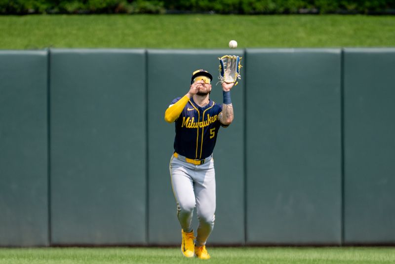 Jul 21, 2024; Minneapolis, Minnesota, USA; Milwaukee Brewers center field Garrett Mitchell (5) catches a fly ball hit by Minnesota Twins outfielder Manuel Margot (13) in the eighth inning at Target Field. Mandatory Credit: Matt Blewett-USA TODAY Sports