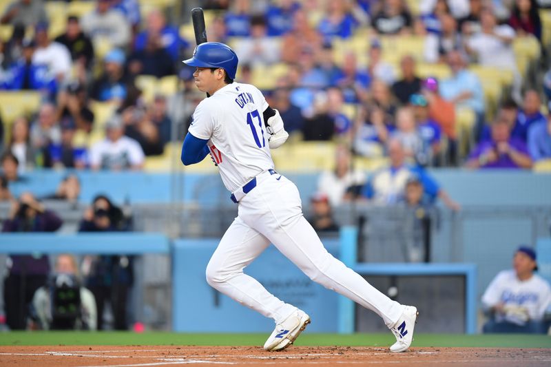 May 31, 2024; Los Angeles, California, USA; Los Angeles Dodgers designated hitter Shohei Ohtani (17) grounds out against the Colorado Rockies during the first inning at Dodger Stadium. Mandatory Credit: Gary A. Vasquez-USA TODAY Sports