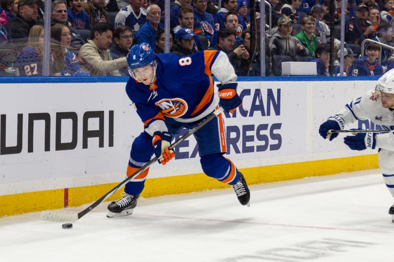 Dec 11, 2023; Elmont, New York, USA; New York Islanders defenseman Noah Dobson (8) controls the puck against the Toronto Maple Leafs during the third period at UBS Arena. Mandatory Credit: Thomas Salus-USA TODAY Sports